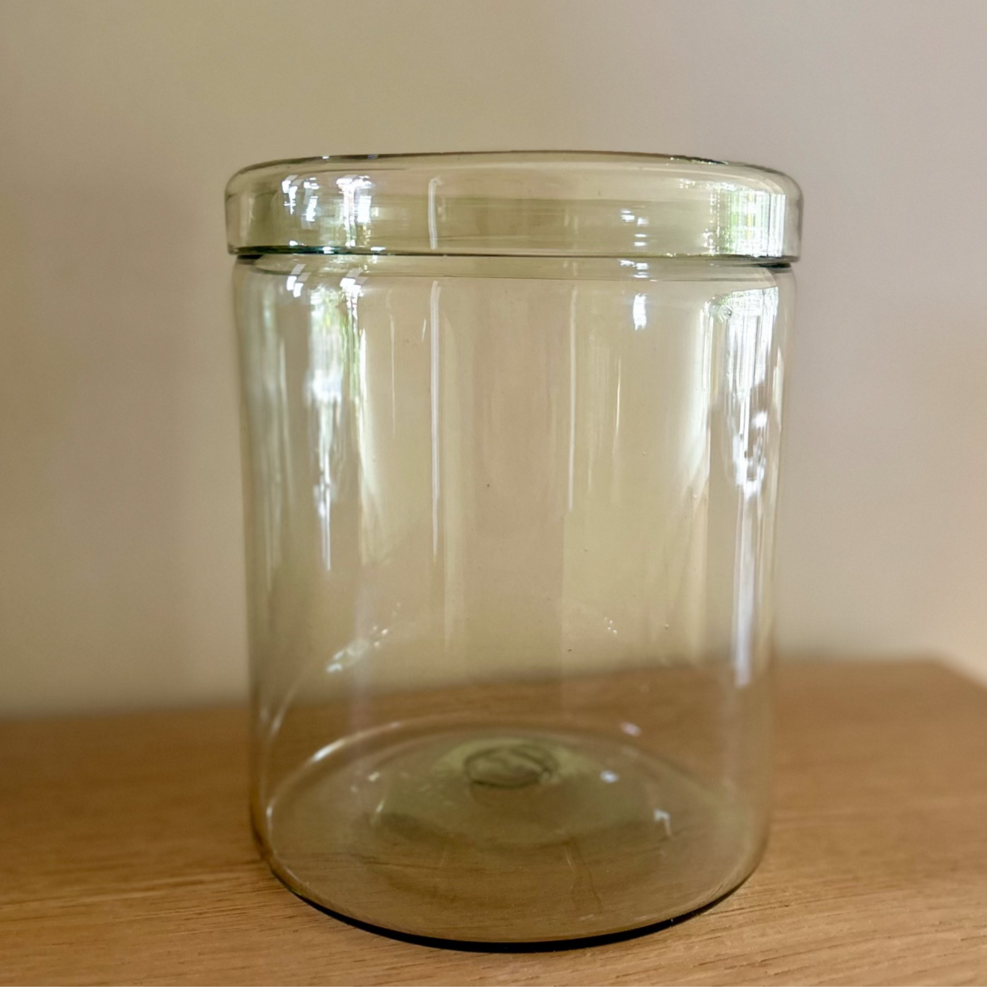 Apothecary Jar by Bitters Co., made from handblown recycled glass, with a simple and elegant design, perfect for storing or displaying items in any space.