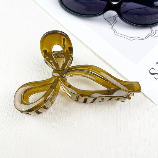 Handmade Jelly Bow Hair Clip in Olive featuring an oversized transparent bow design crafted from jelly material, perfect for adding whimsy to any hairstyle. 