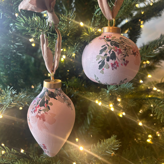 Hand Painted Ornament by Kate Nelson with floral brushstrokes and chiffon ribbon, each unique, and packaged in a linen bag for gifting and storage.